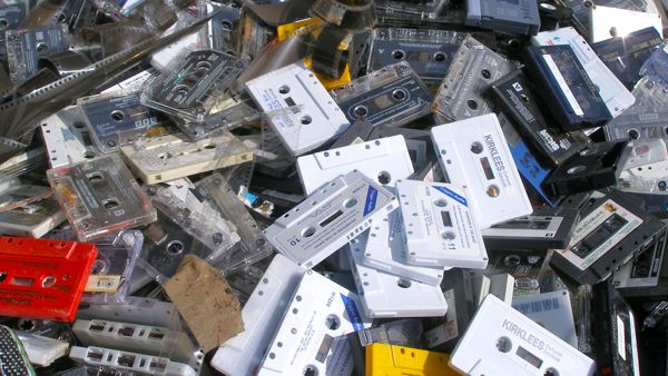 mountainous pile of old cassette tapes