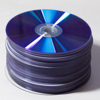 cylindrical stack of shiny purple DVD-R discs